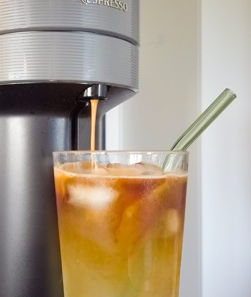 Liminha over ice coffee dripping from Nespresso machine