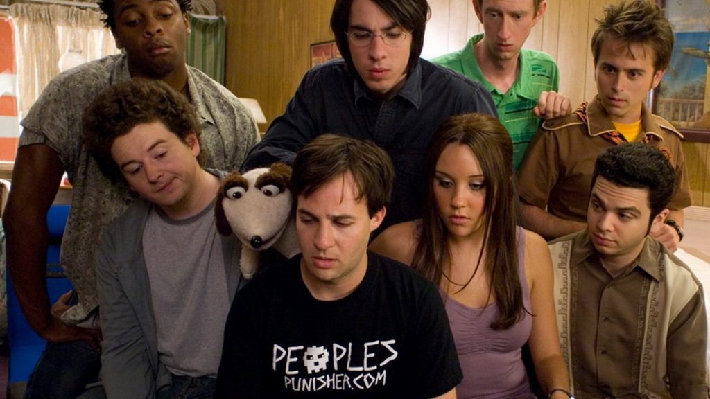 A group of college student looking at the same screen from the movie Sydney White